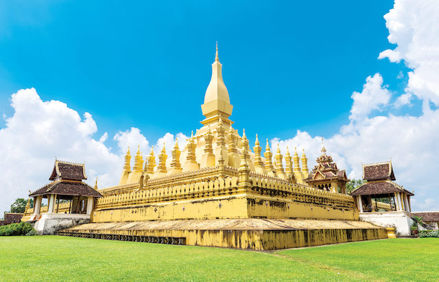 Laos-travel-landmark,-golden-pagoda-wat-Phra-That-Luang-in-Vientiane.-Buddhist-temple